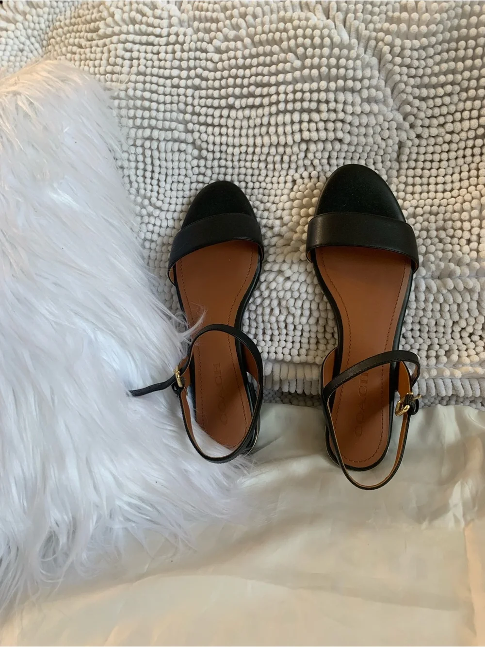 NWOT. Coach smooth leather, black sandals. Gold hardware.
